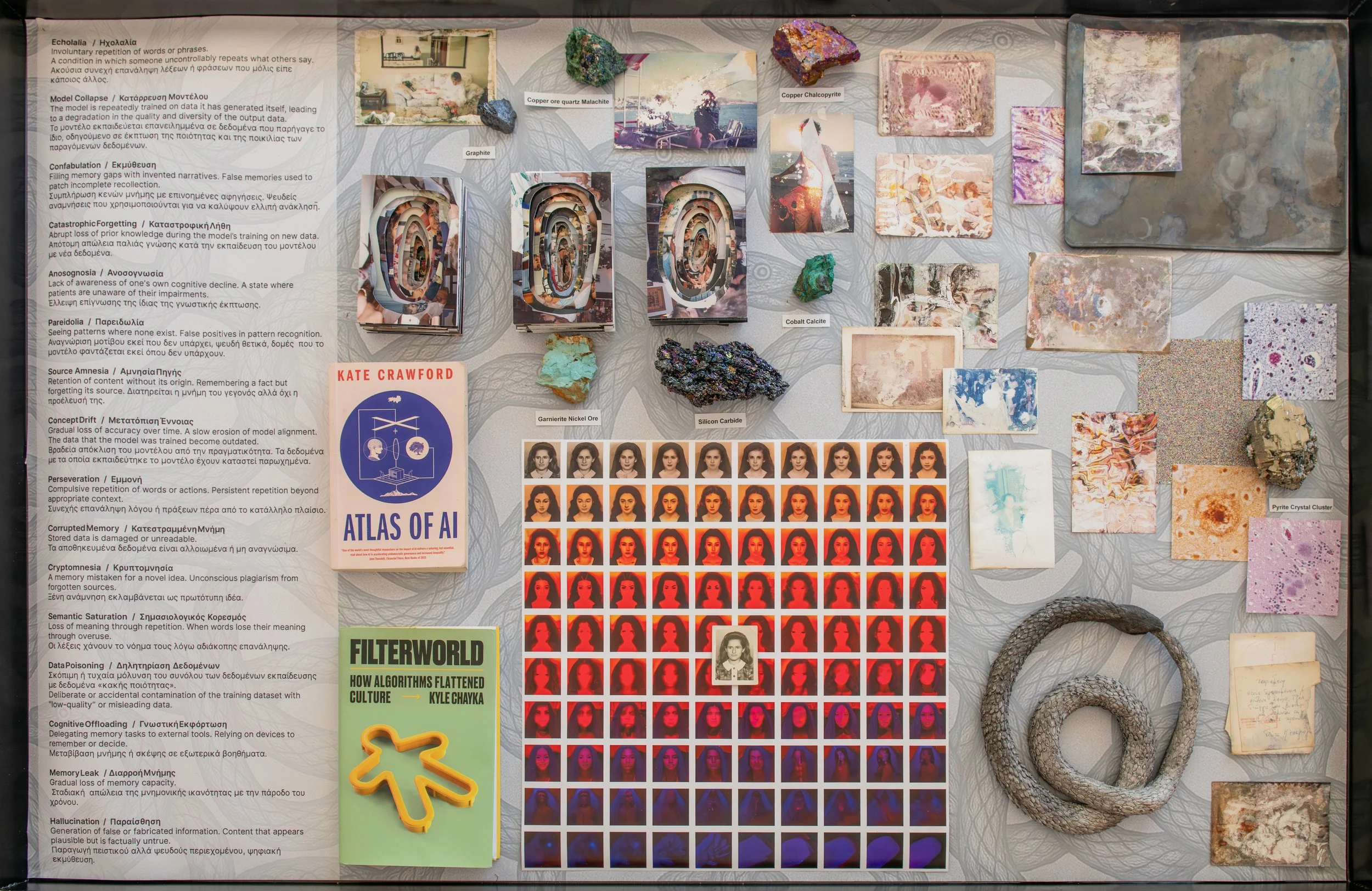 Archive of Extraction table installation combining books, medical and technological terms, minerals, family photographs and artistic tests.