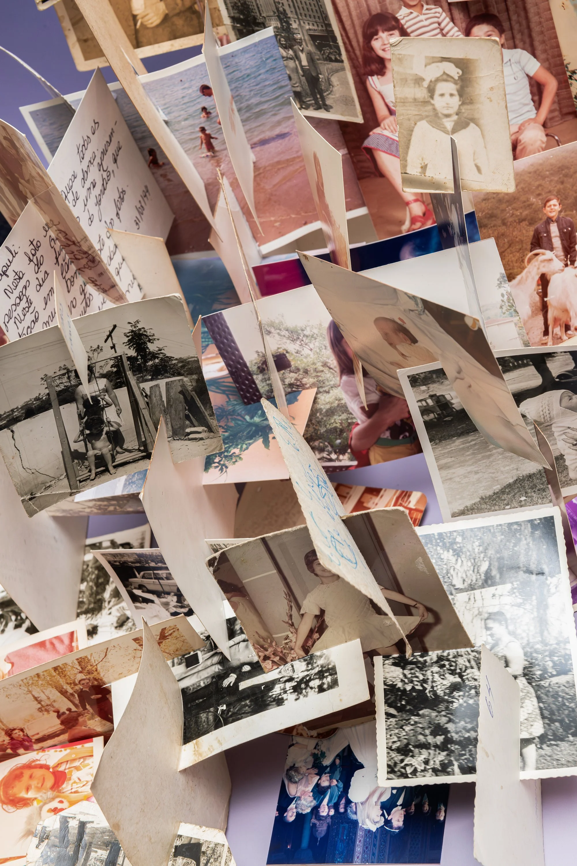 Detail of Latent Memory showing overlapping family photographs that intersect, obscure one another and prevent a complete image from forming.