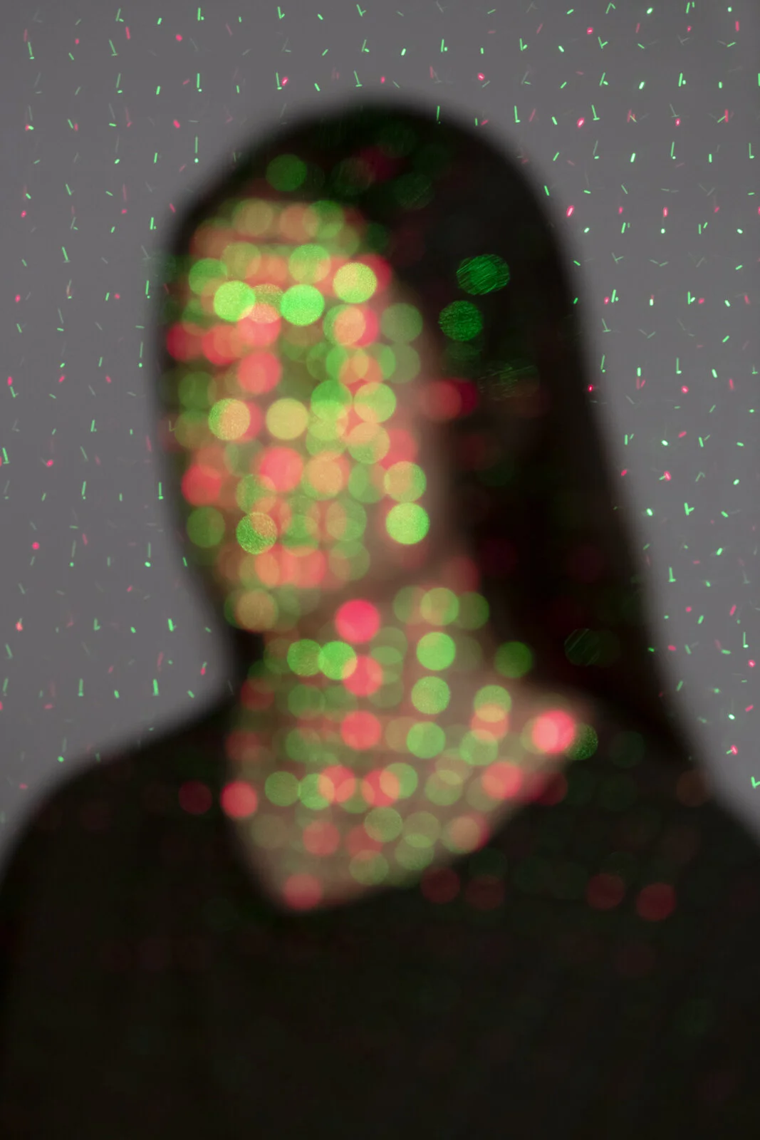 The Average of Everything from Image Eaters: a blurred human portrait overlaid with facial-recognition landmarks, reducing identity to machine-readable data.