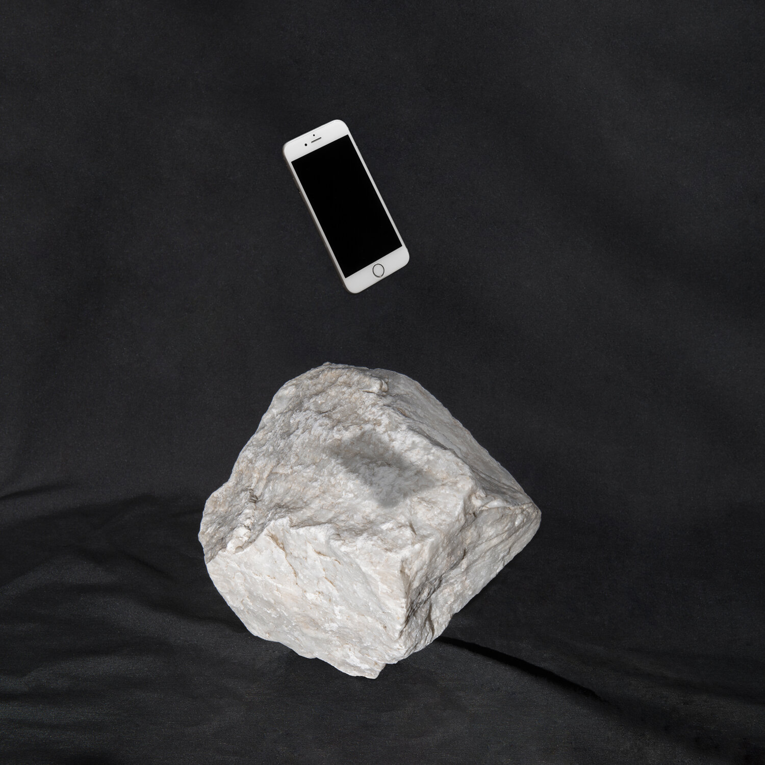 Paper, Stone, Scissors from Image Eaters, examining the continuing tension between physical photographs and digital images.