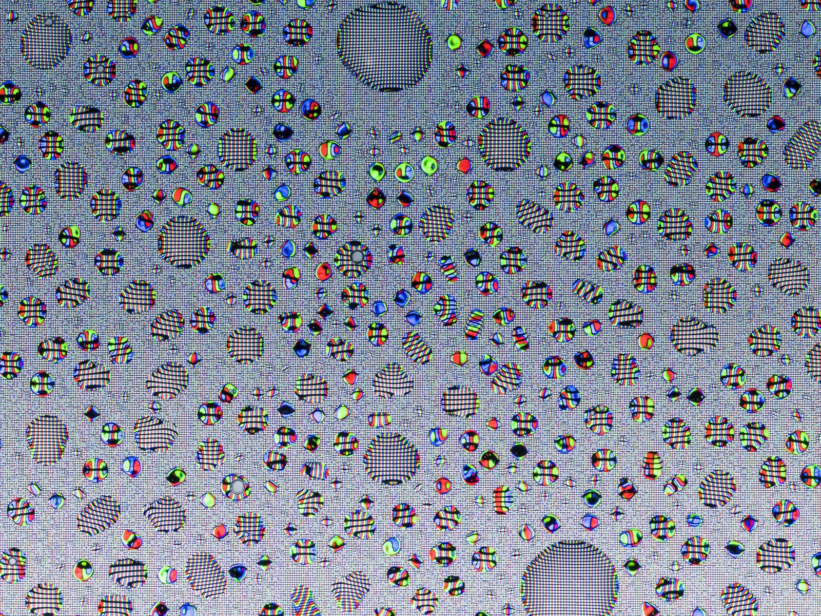 Magnified detail of the Tumblr image from Tears, Spit & Cum, showing organic droplets distorting the RGB pixels and color gradients of a digital screen.