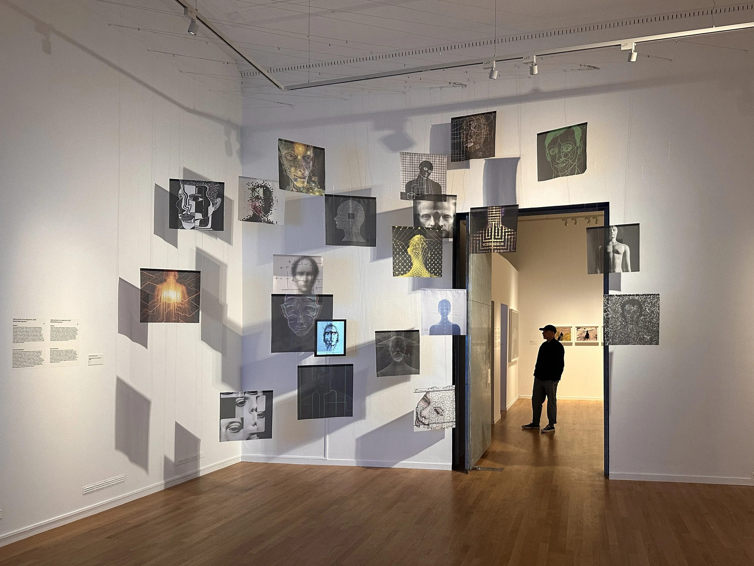 Installation view of A Self-Portrait of an Algorithm at Missing Mirror, FOAM Amsterdam, 2024, presenting AI portraits about self-representation, machine identity and possible machine sentience.