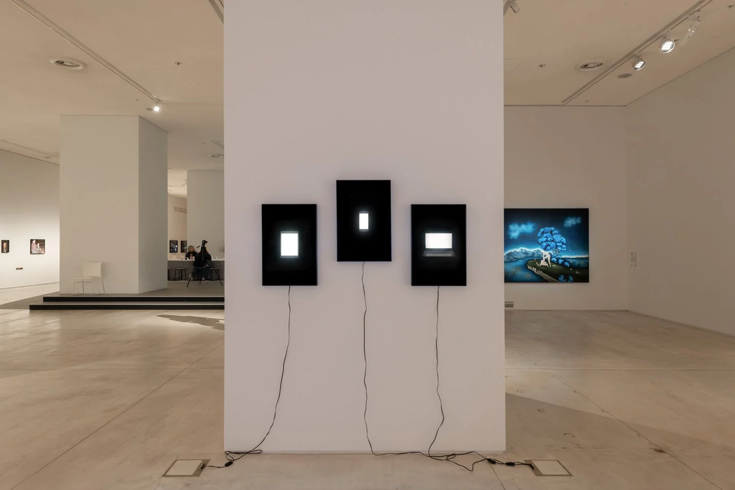 Installation view of Family Portraits in Modern Love at EMST, Athens, 2023, showing works that reverse subject and object by portraying connected devices within domestic family scenes.