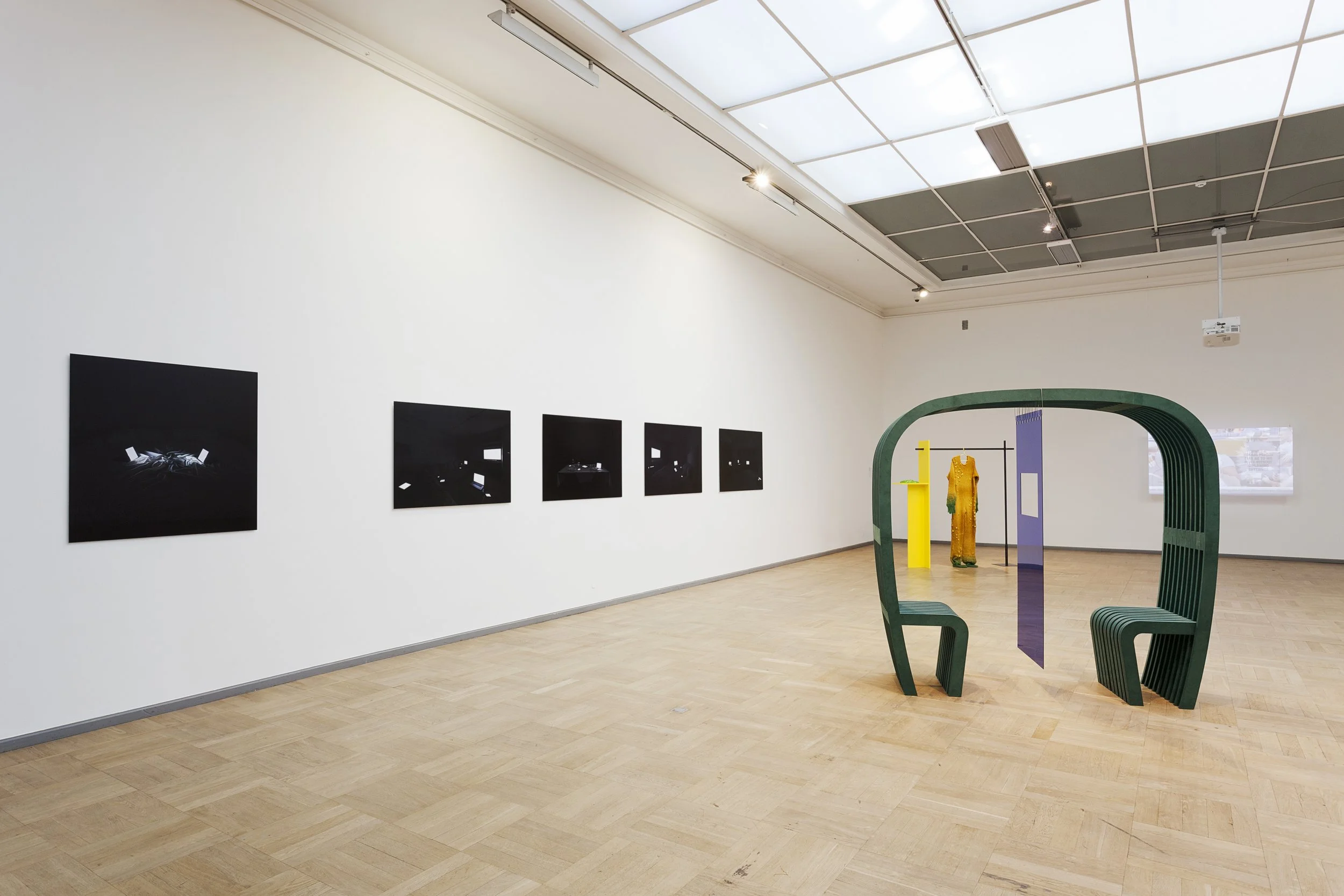 Installation view of Family Portraits in Modern Love at Tallinn Art Hall, Estonia, 2021, showing photographs of connected devices staged as family members and intimate companions.