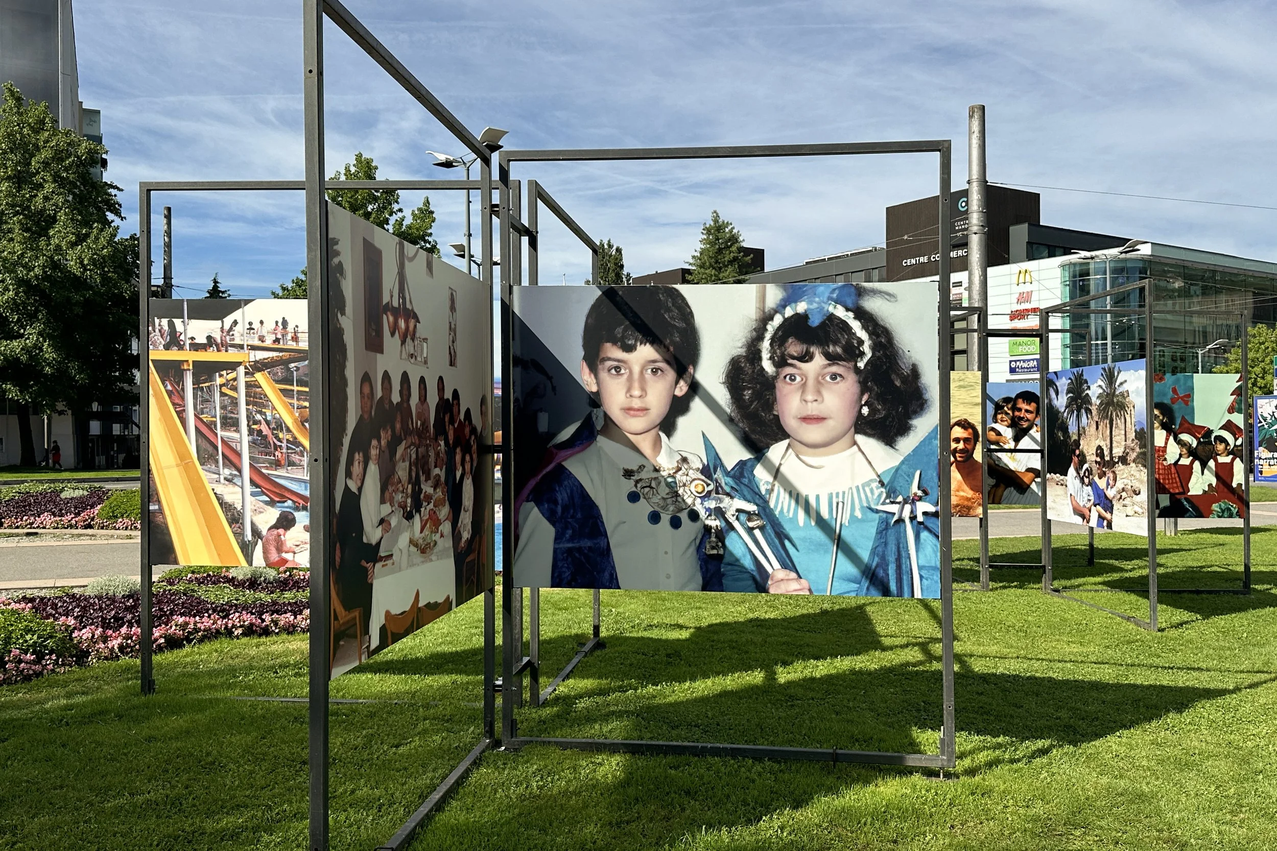Installation photograph from Images Vevey showing Imagined Images as an outdoor archive of AI-generated family scenes and inherited memories.