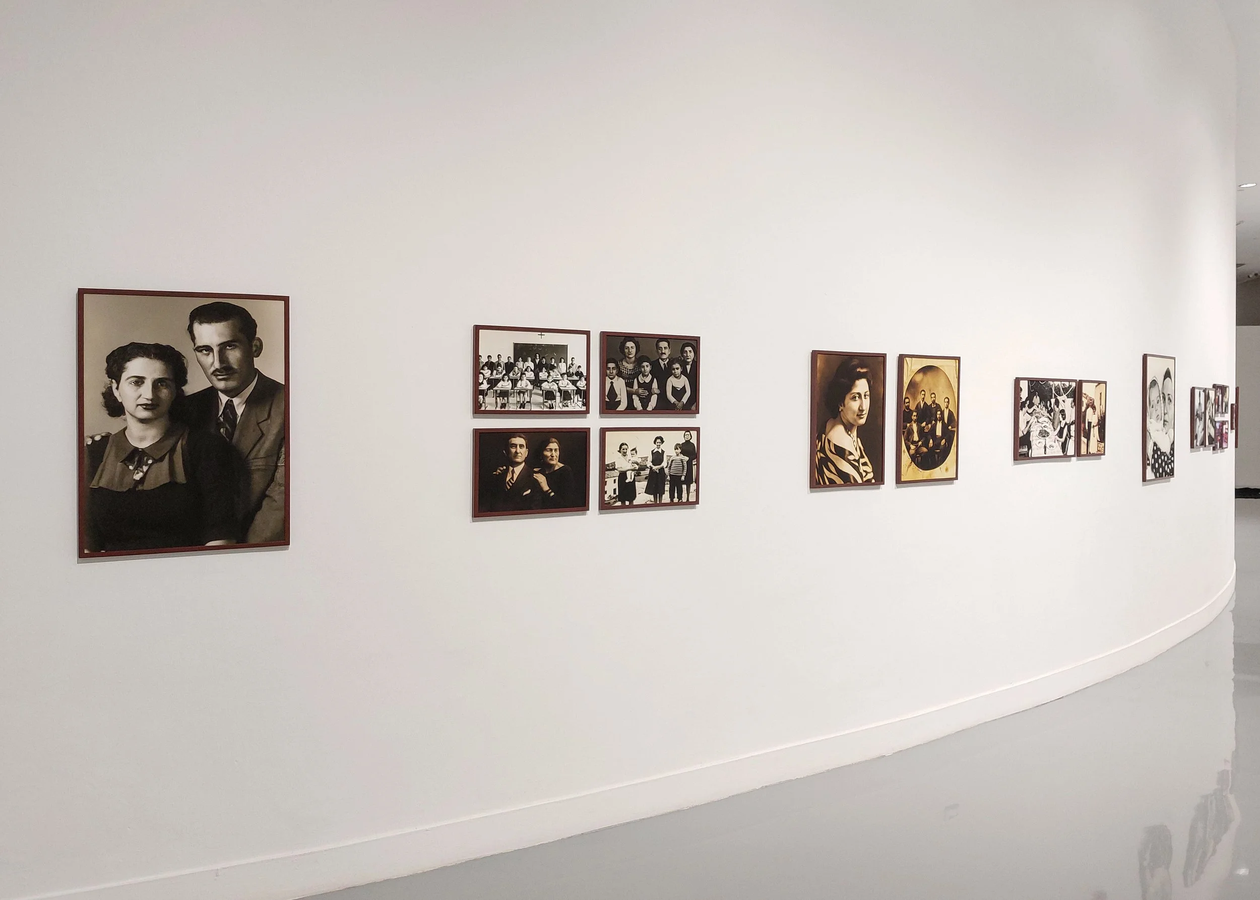 Gallery view of Imagined Images at BACC Bangkok in 2024, presenting reconstructed family memories as a synthetic photographic archive.