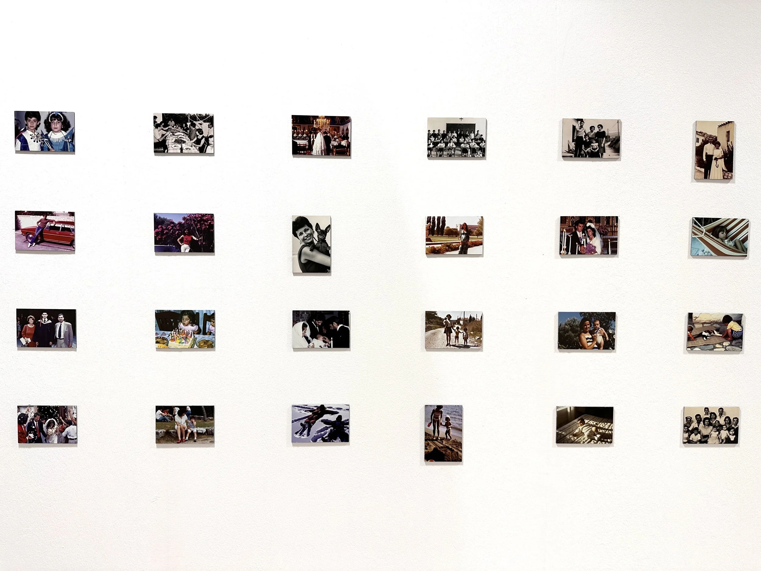 Second installation view of Imagined Images at Photo Vogue Festival, BASE Milan in 2023, showing AI-generated family photographs in Uncanny Atlas.