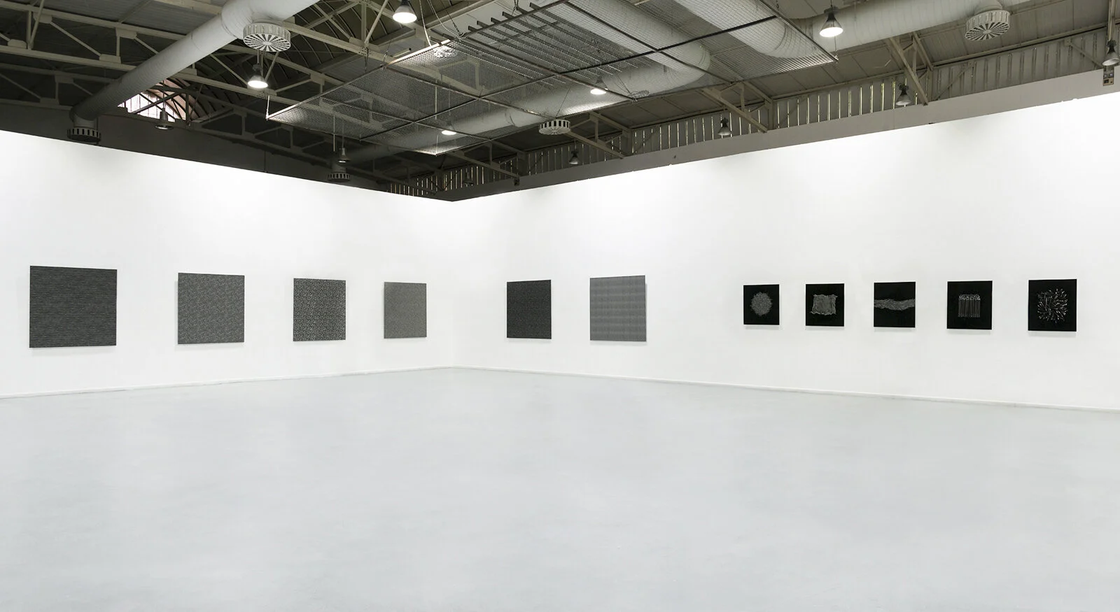 Installation view of Geometry of Chaos at the 2014 Athens School of Fine Arts BA Degree Show, including photographs, drawings and sculptural structures.