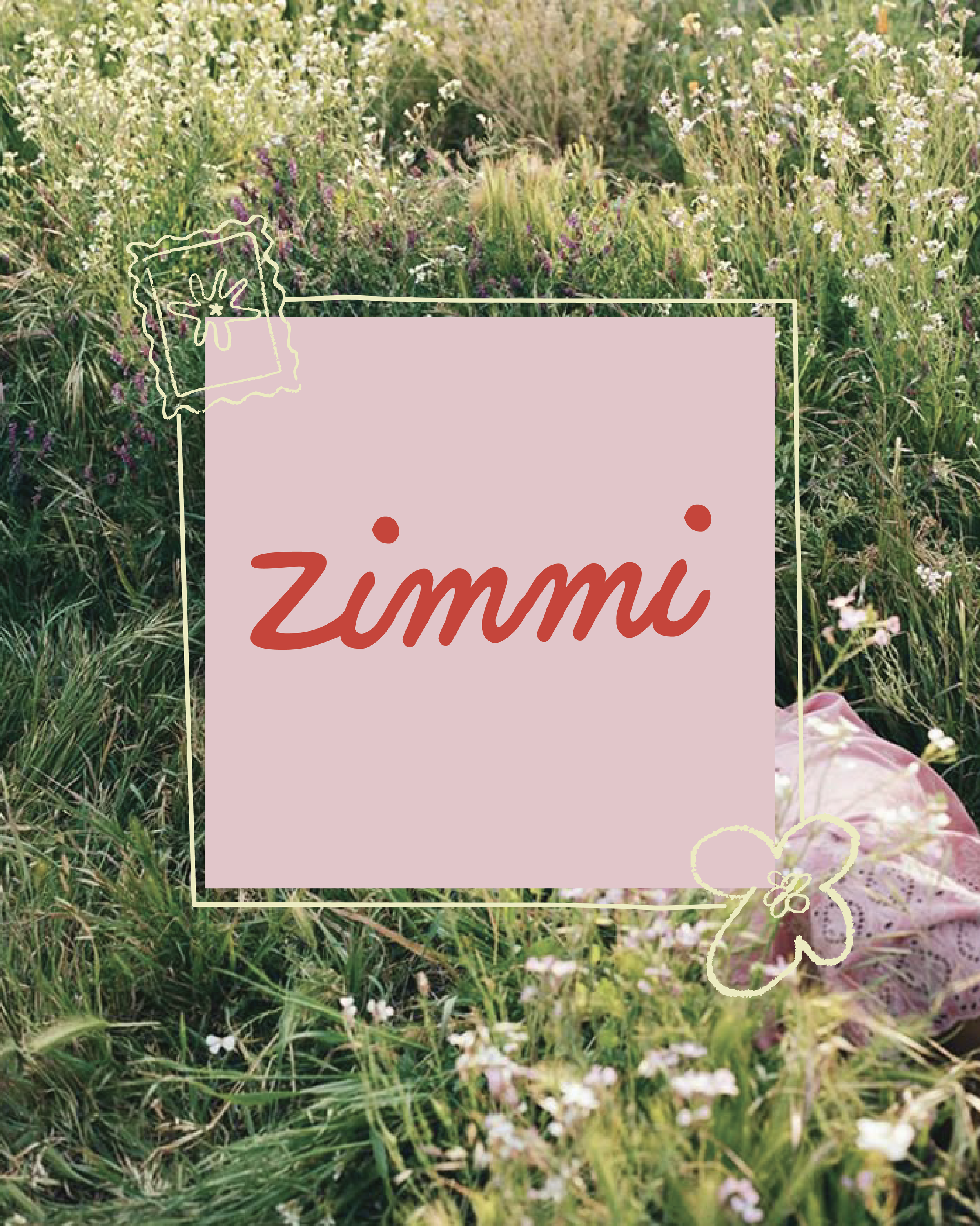 Field of green grass and wildflowers with a pink sign in the center that says 'Zimmi' in red cursive and a white heart outline with a butterfly design on the bottom right.