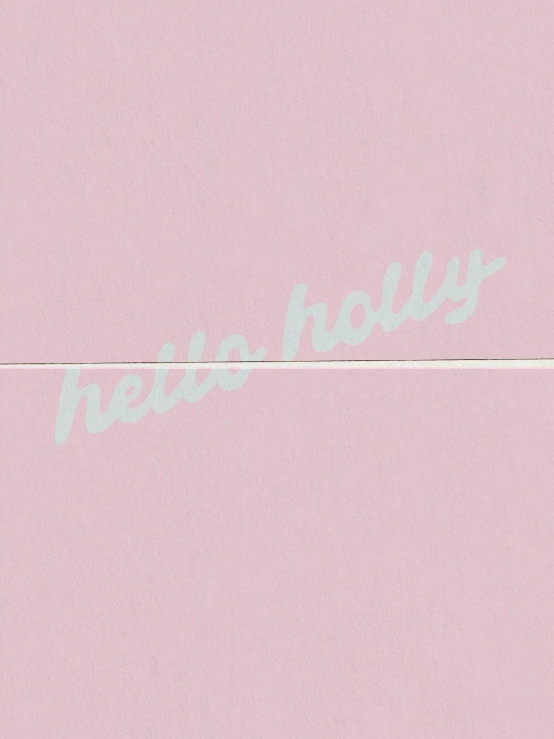 Pink background with the words "hello holly" written in white cursive text.