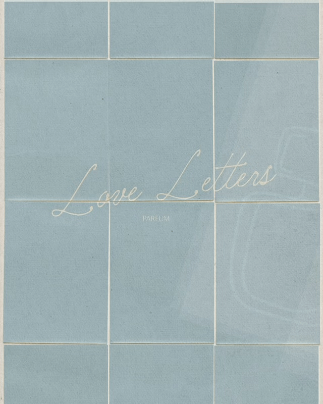 Tile wall with the words "Love Letters" written in cursive and "Parfum" underneath.