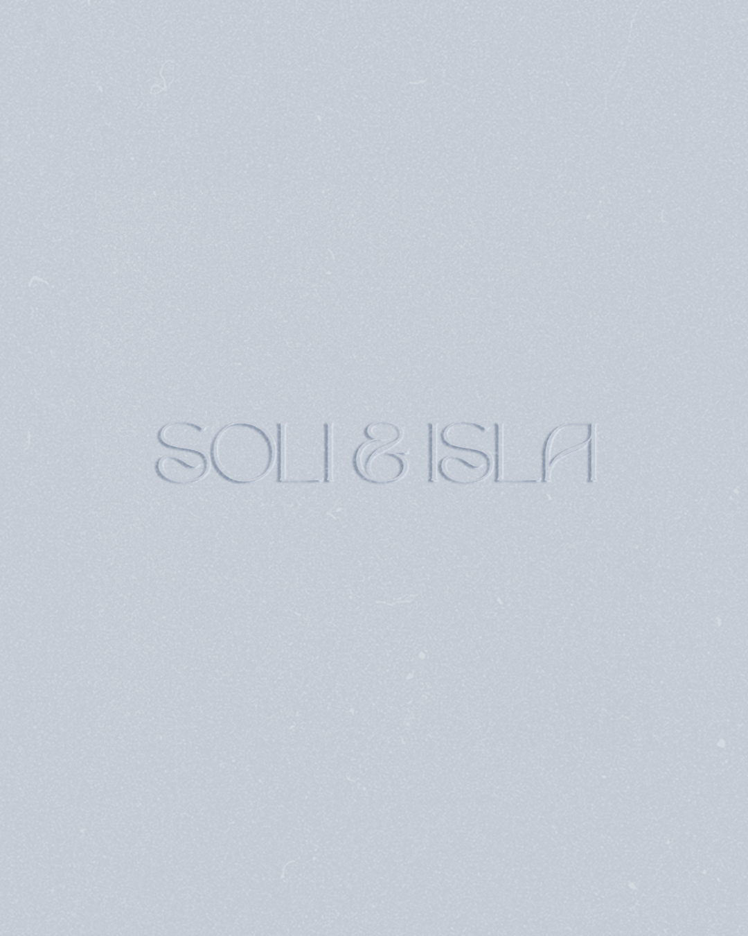 A white textured surface with the phrase 'SO IS ISLA' embossed in the center.