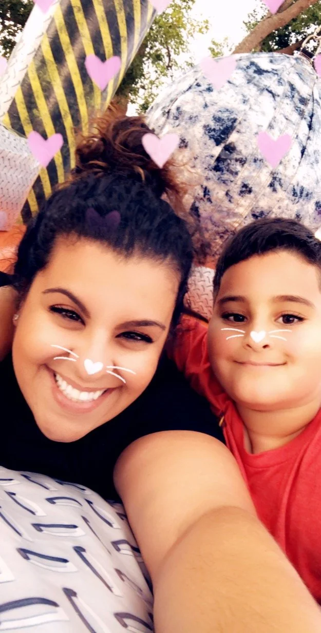Julie and kid Nick with cute heart noses.JPG