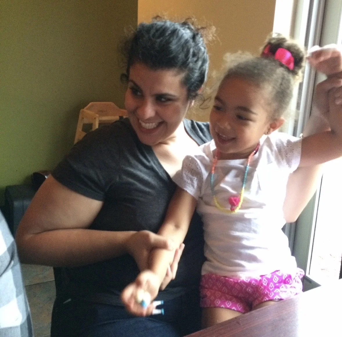 Julie and kid Jour hands up.jpg