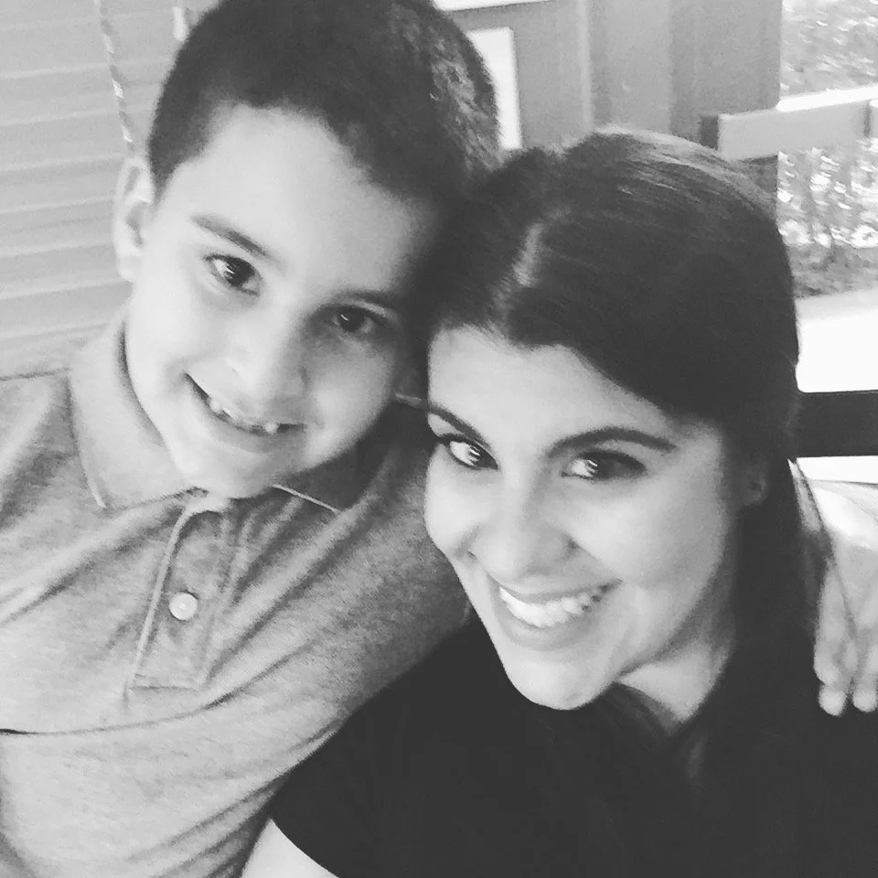 Julie and kid Nick black and white smile and hug.JPG
