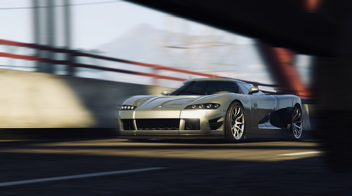 Silver high-performance sports car speeding on a city street at sunset, blurred background.