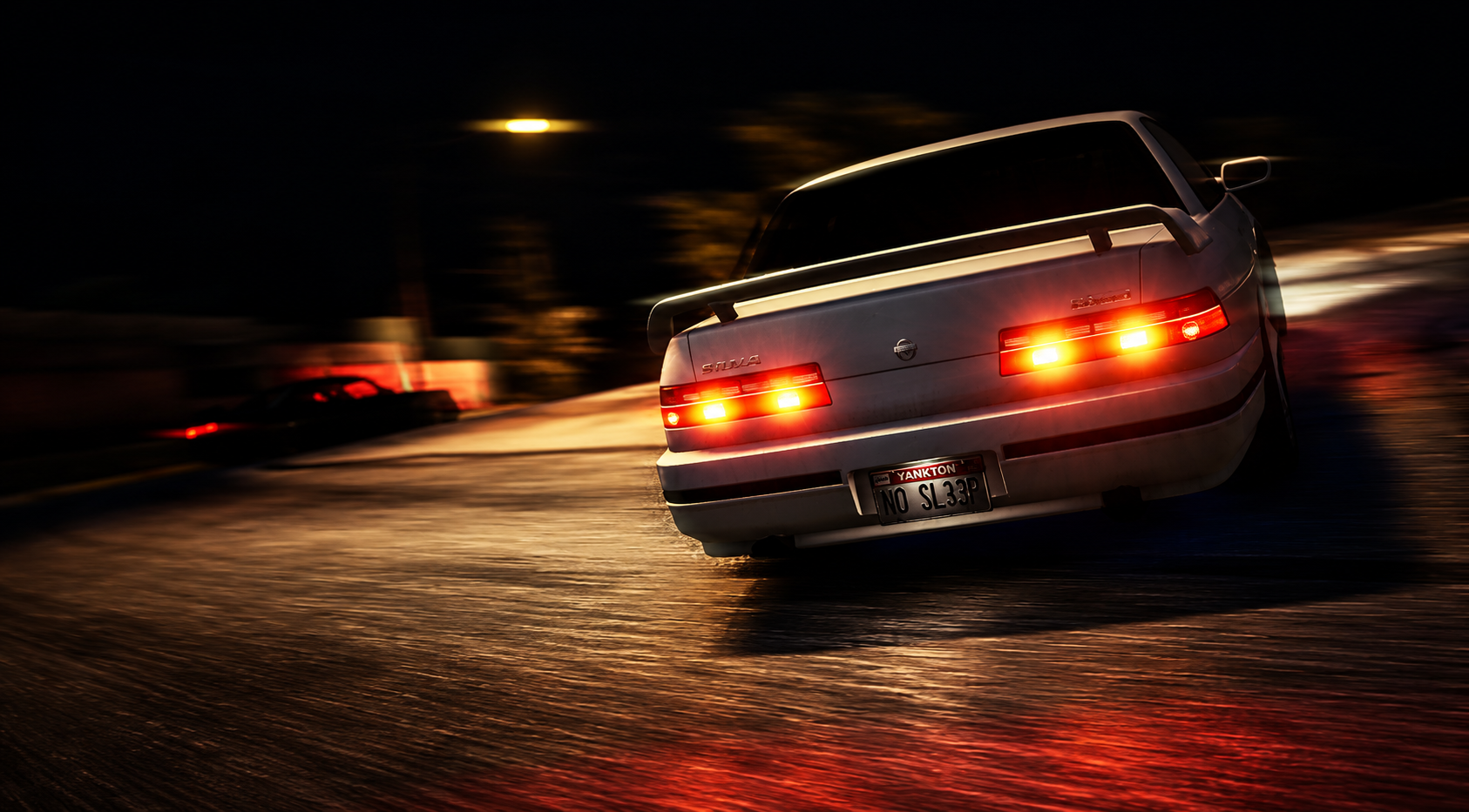 A white sports car speeding on a wet road at night, with its taillights illuminated and creating reflections on the surface.