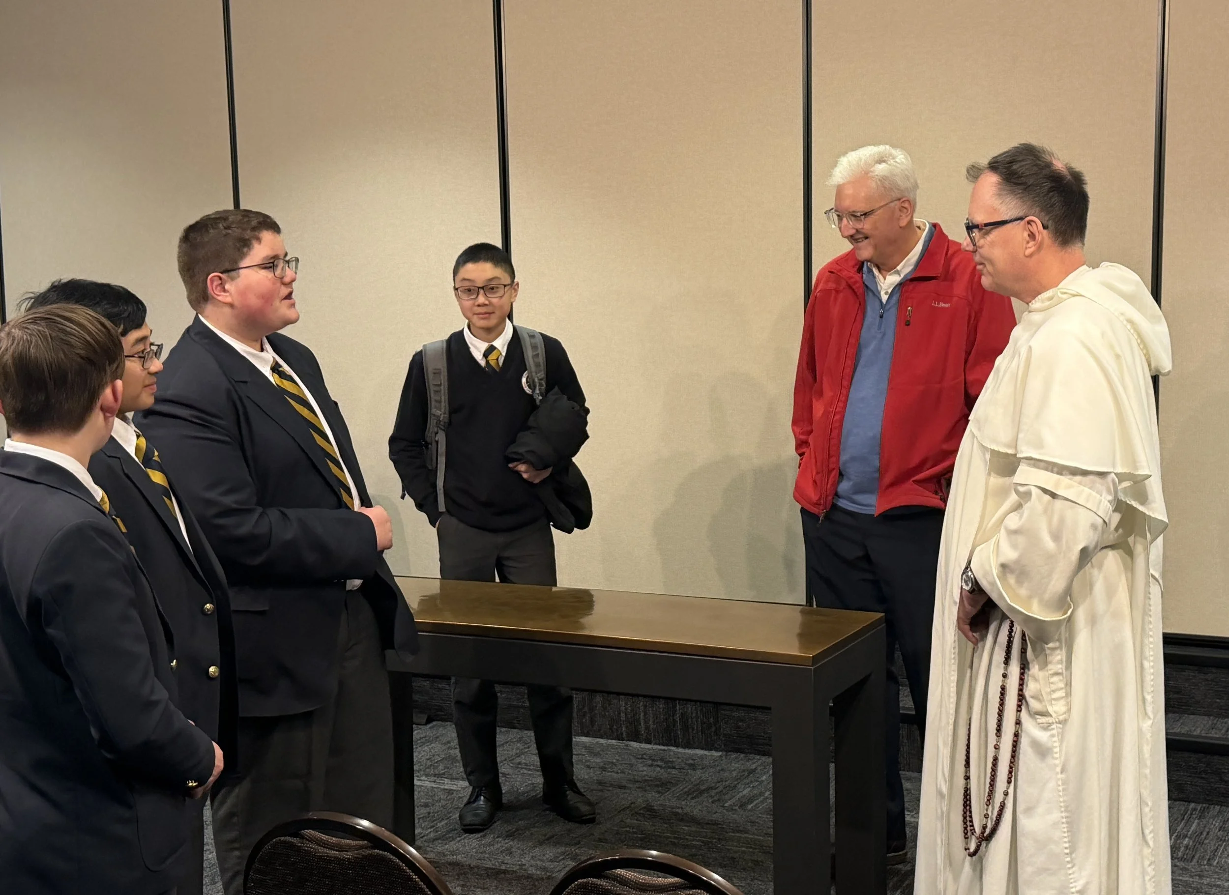 CASM students speaking with Father