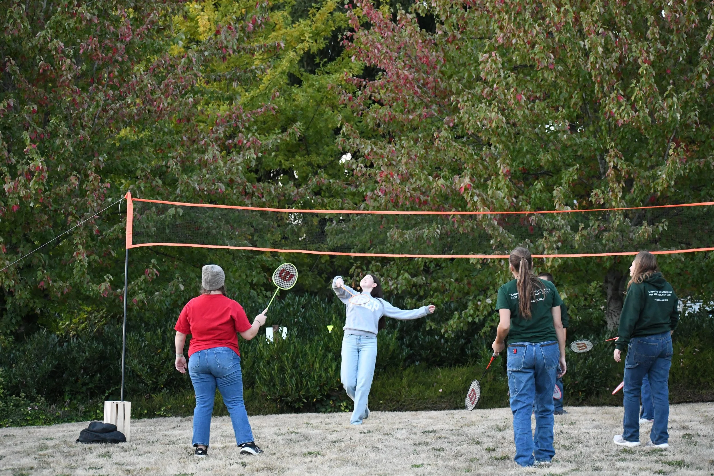 Students playing badminton at Michaelmas celebration