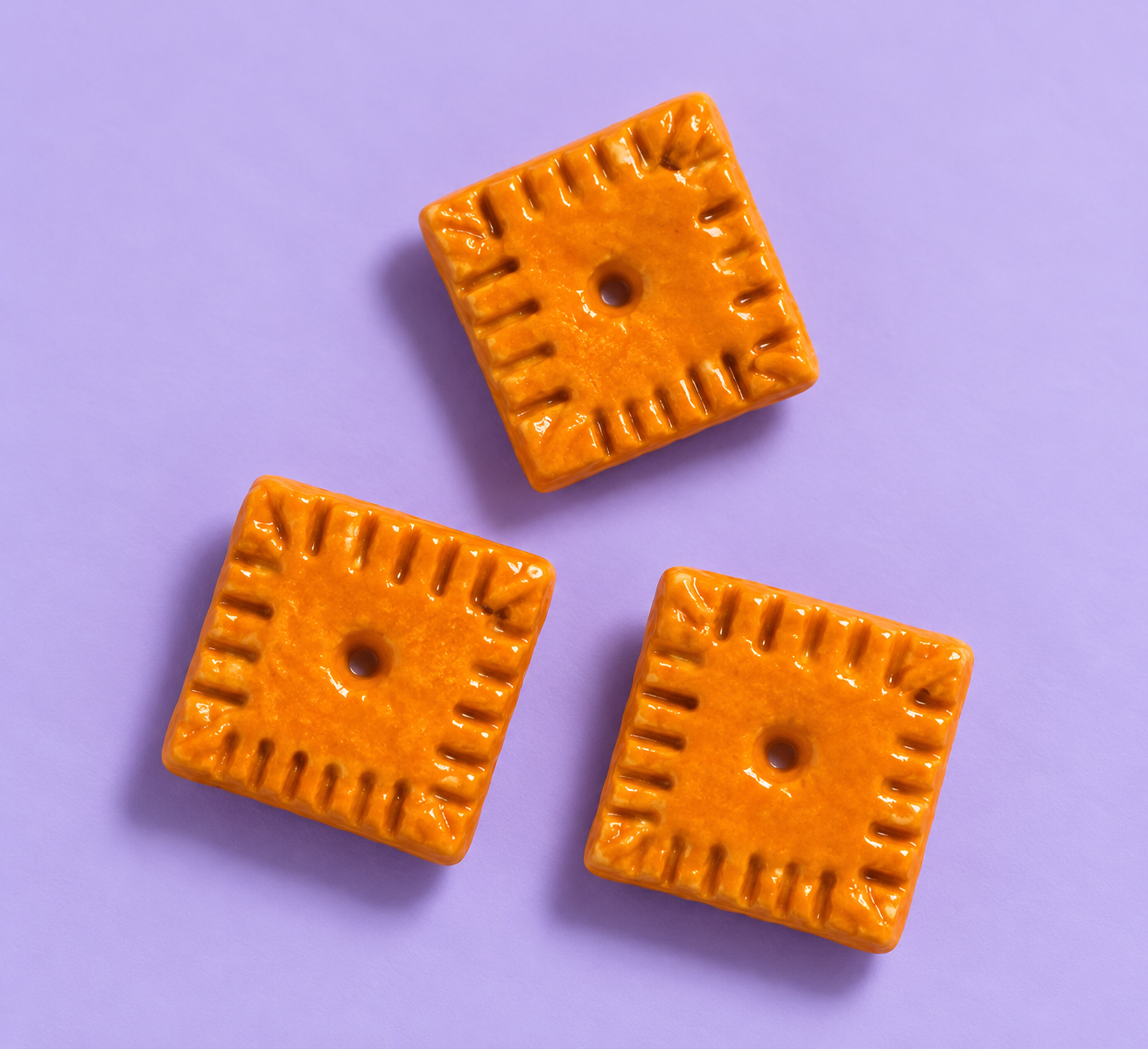 Glossy Cheddar Cracker Tiles on Lavender.png