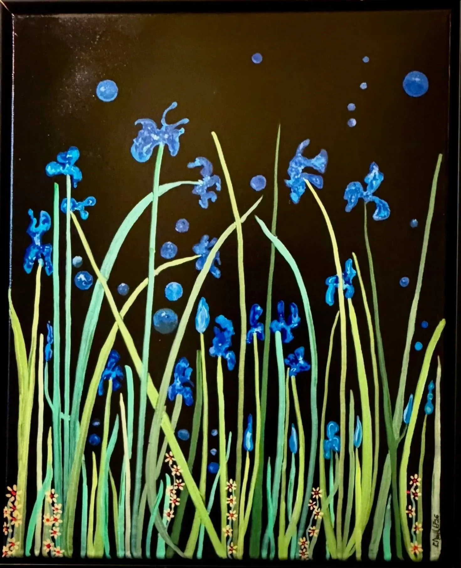 Colorful painting of tall green grass with blue flowers and small plants, set against a dark background with scattered blue dots and circles, and some tiny light-colored flowers at the bottom.