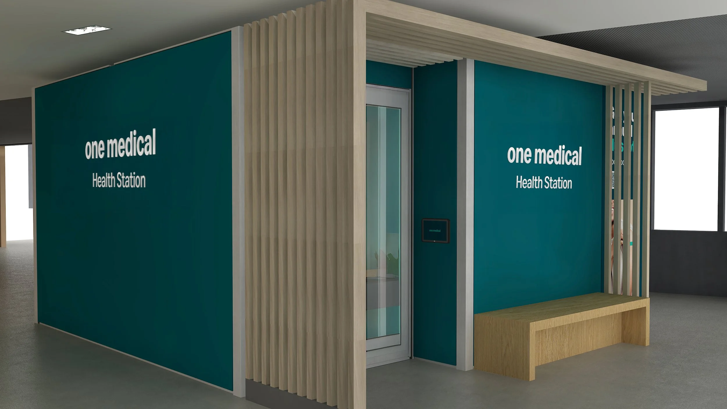 A modern medical kiosk with teal walls, white text reading 'one medical Health Station,' and wooden accents, located indoors near a window.