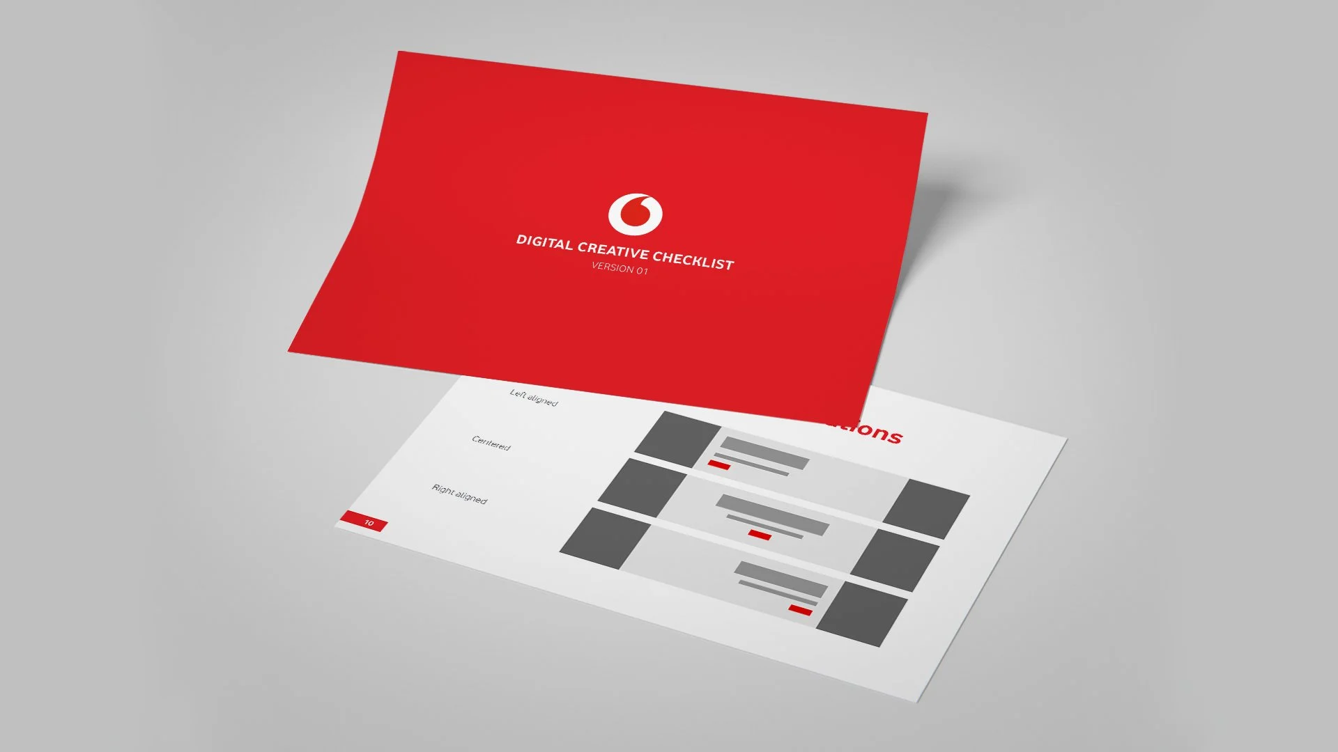 Red folder labeled "Digital Creative Checklist Version 01" on top of a white sheet with design tips and gray, red, and black diagram elements.