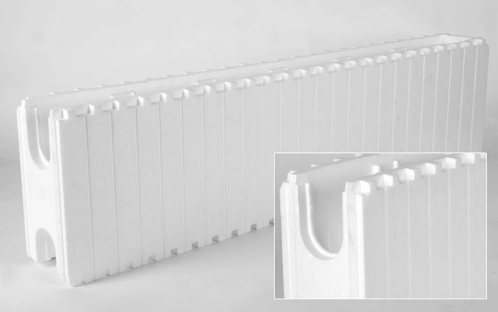 White foam packaging with interlocking edges and a cut-out handle
