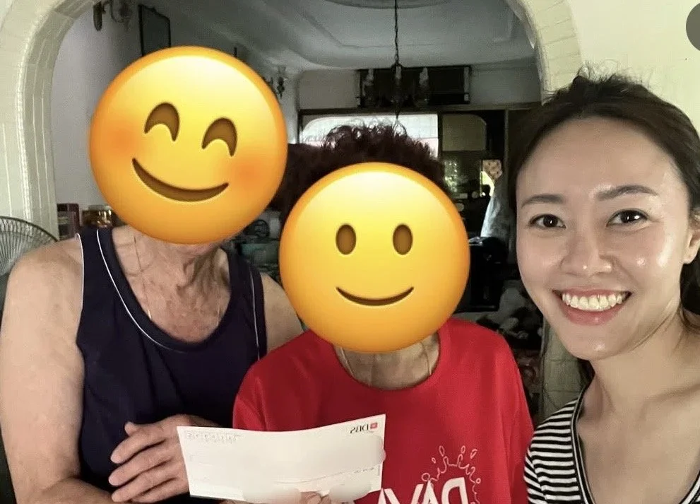 Valerie Ng with clients celebrating a completed deal