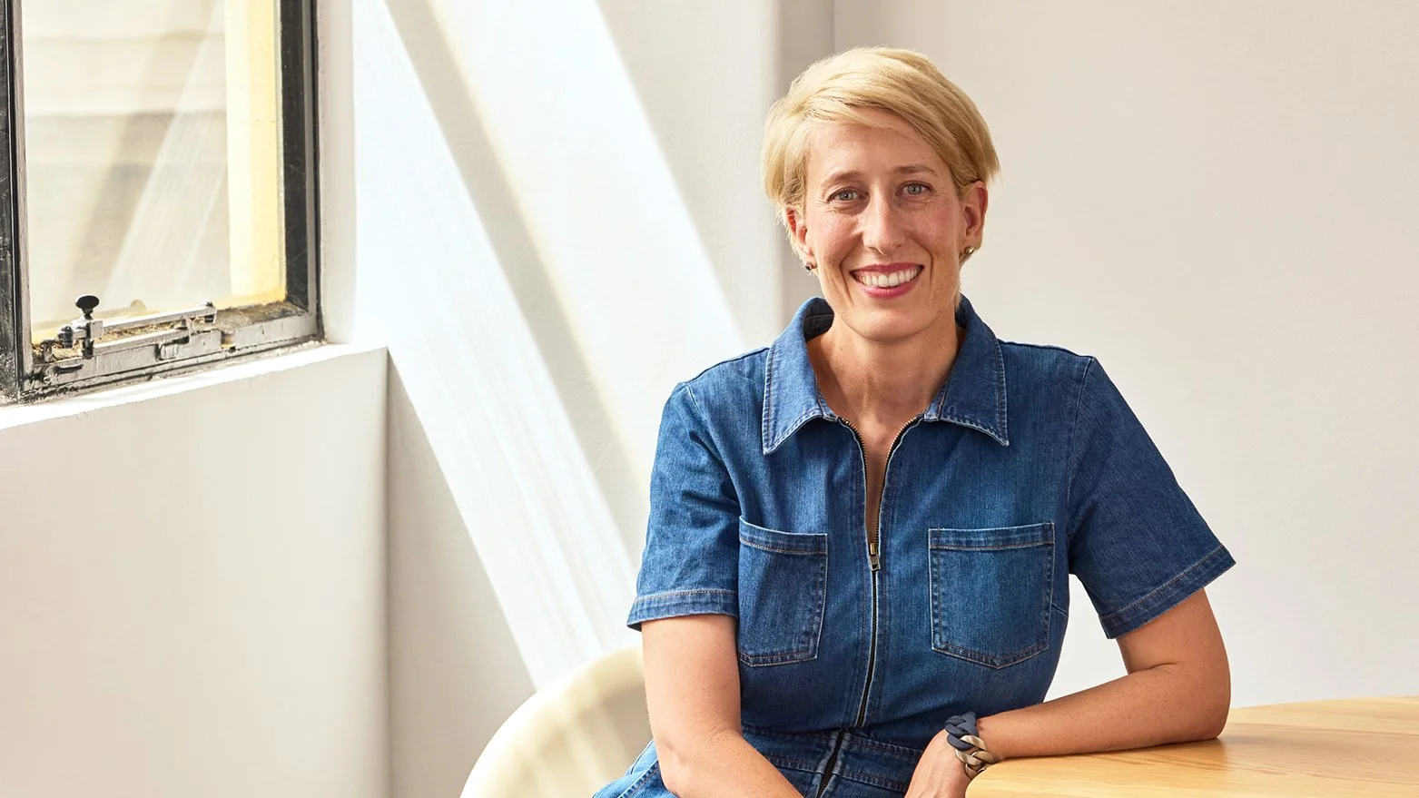 Julie Corbett sitting in office