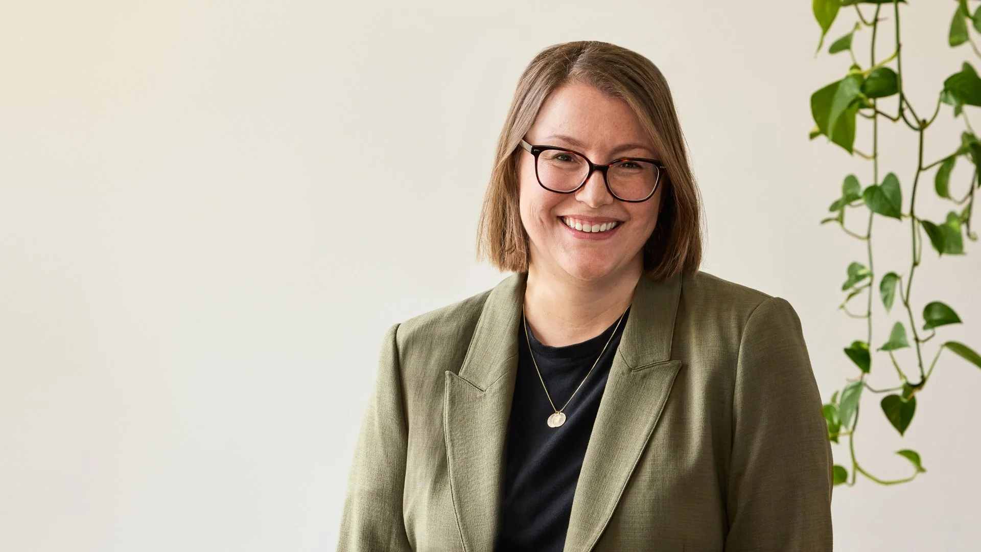 A smiling portrait of Lizzie Deller, co-founder and Creative Director of Studio Hoopla