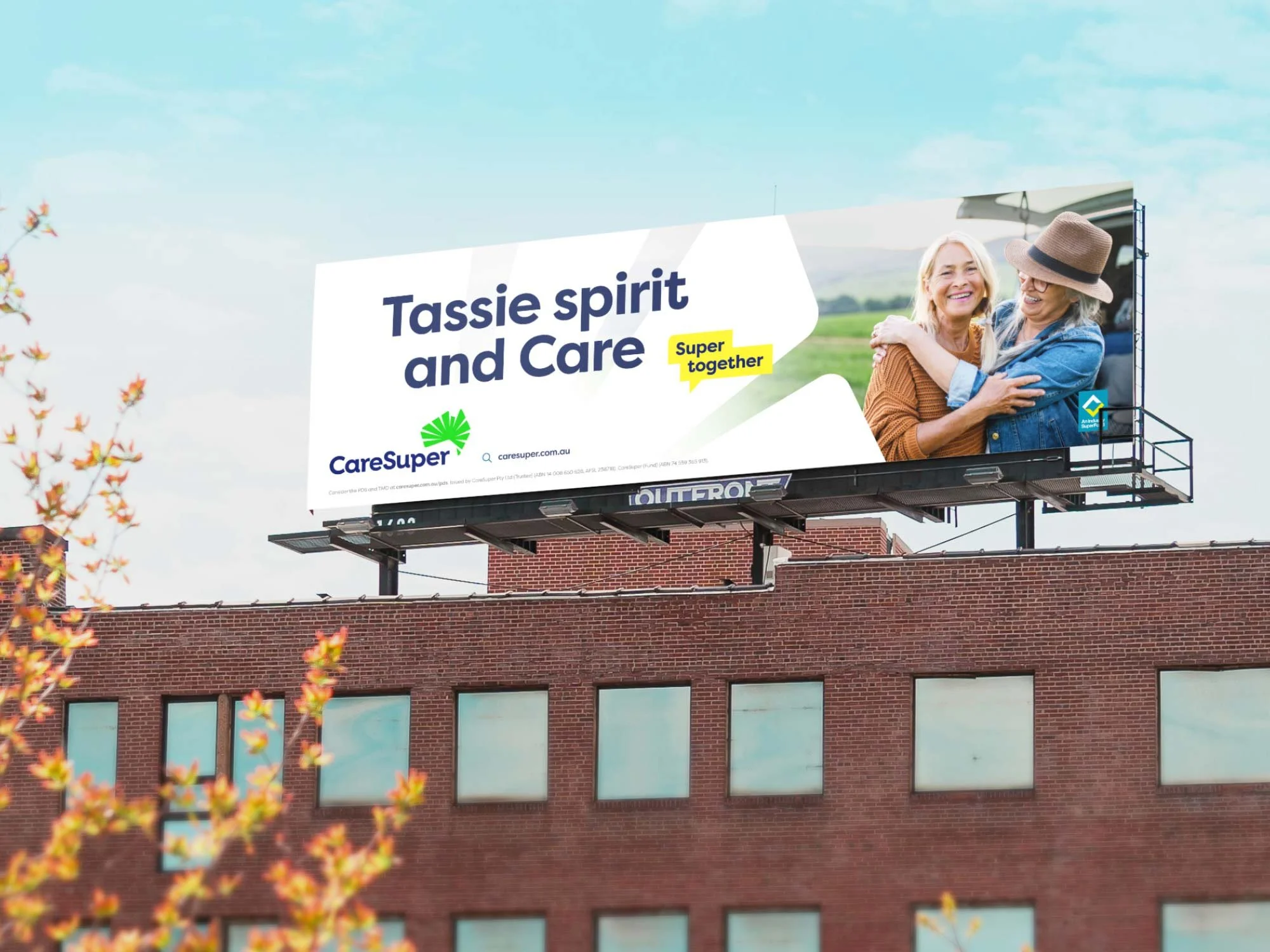An image of a CareSuper billboard with two women hugging that reads 'Tassie spirit and care'