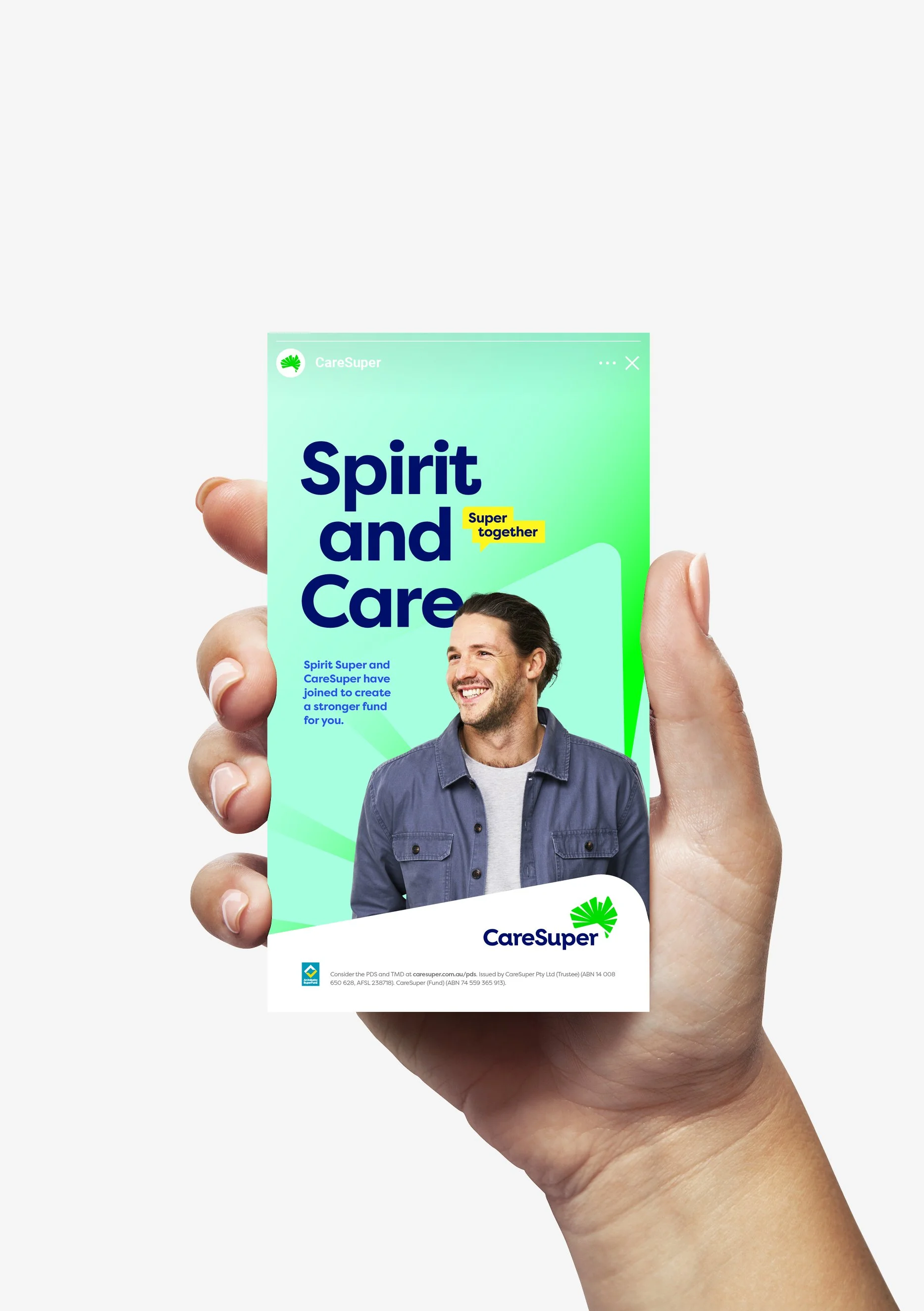 Hand holding a CareSuper promotional flyer featuring a smiling man with dark hair, wearing a denim jacket over a white shirt, against a light green background with text about superannuation.