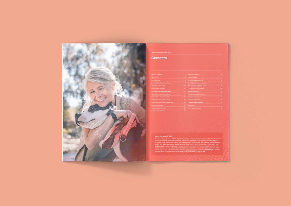Open annual report with a smiling woman hugging a black and white dog outside, and a table of contents on the right page.