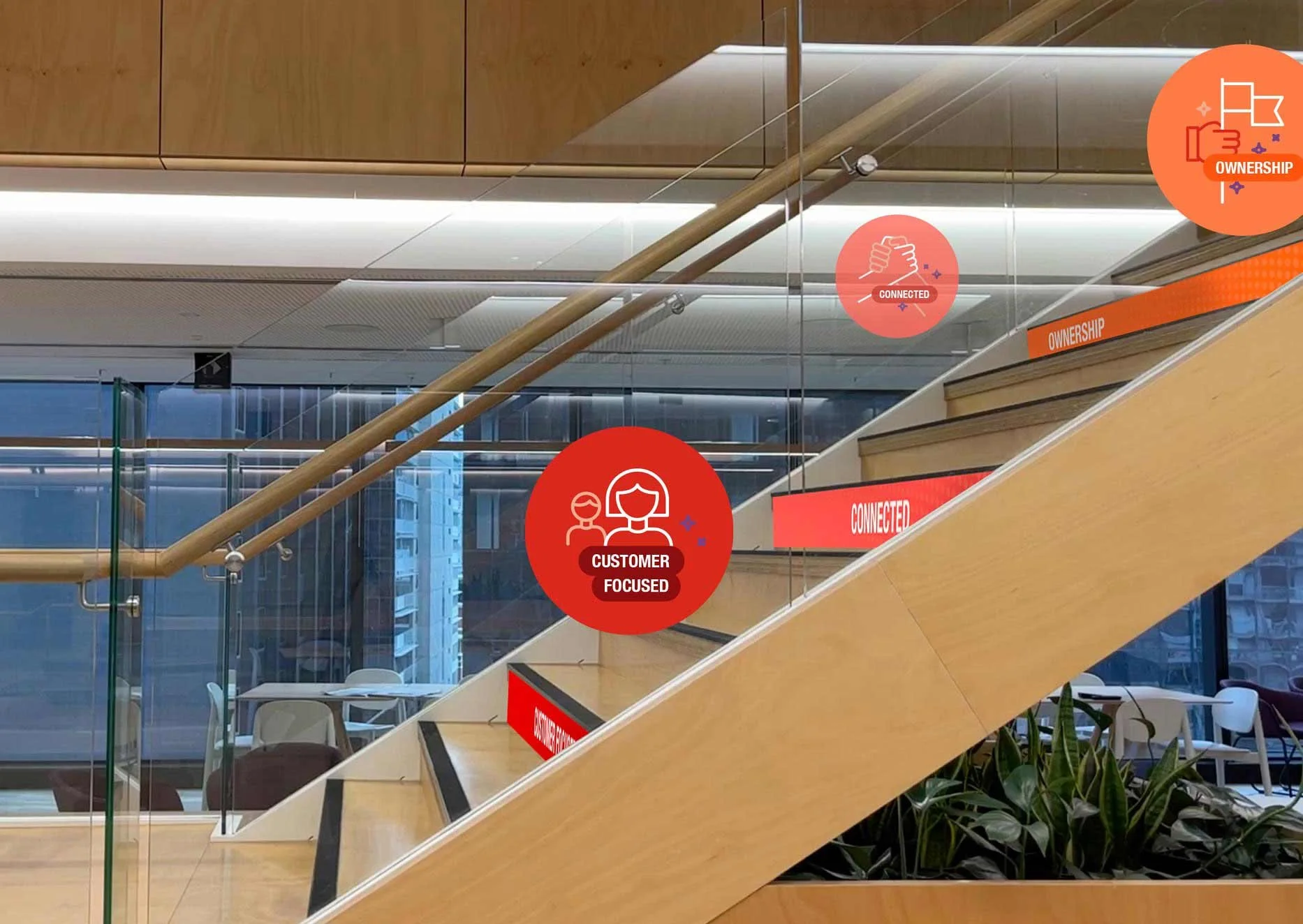 An image of the TelstraSuper employee values lining the side of an internal staircase