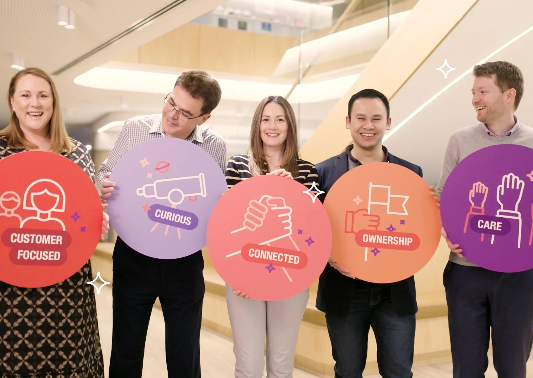Staff holding images of the TelstraSuper value propositions