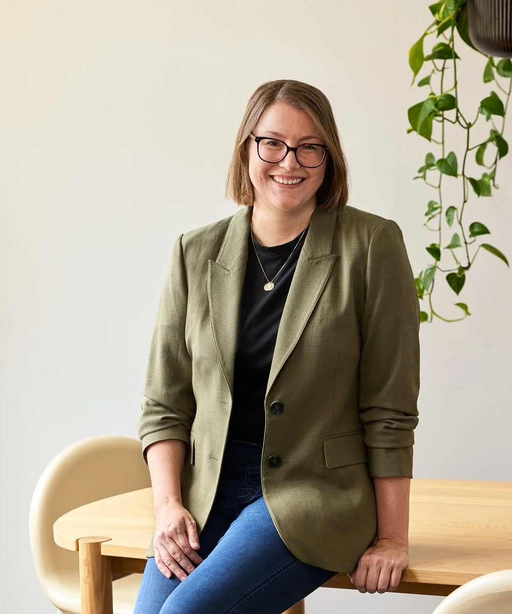 A portrait image of Lizzie Deller, co-founder and creative director of Studio Hoopla