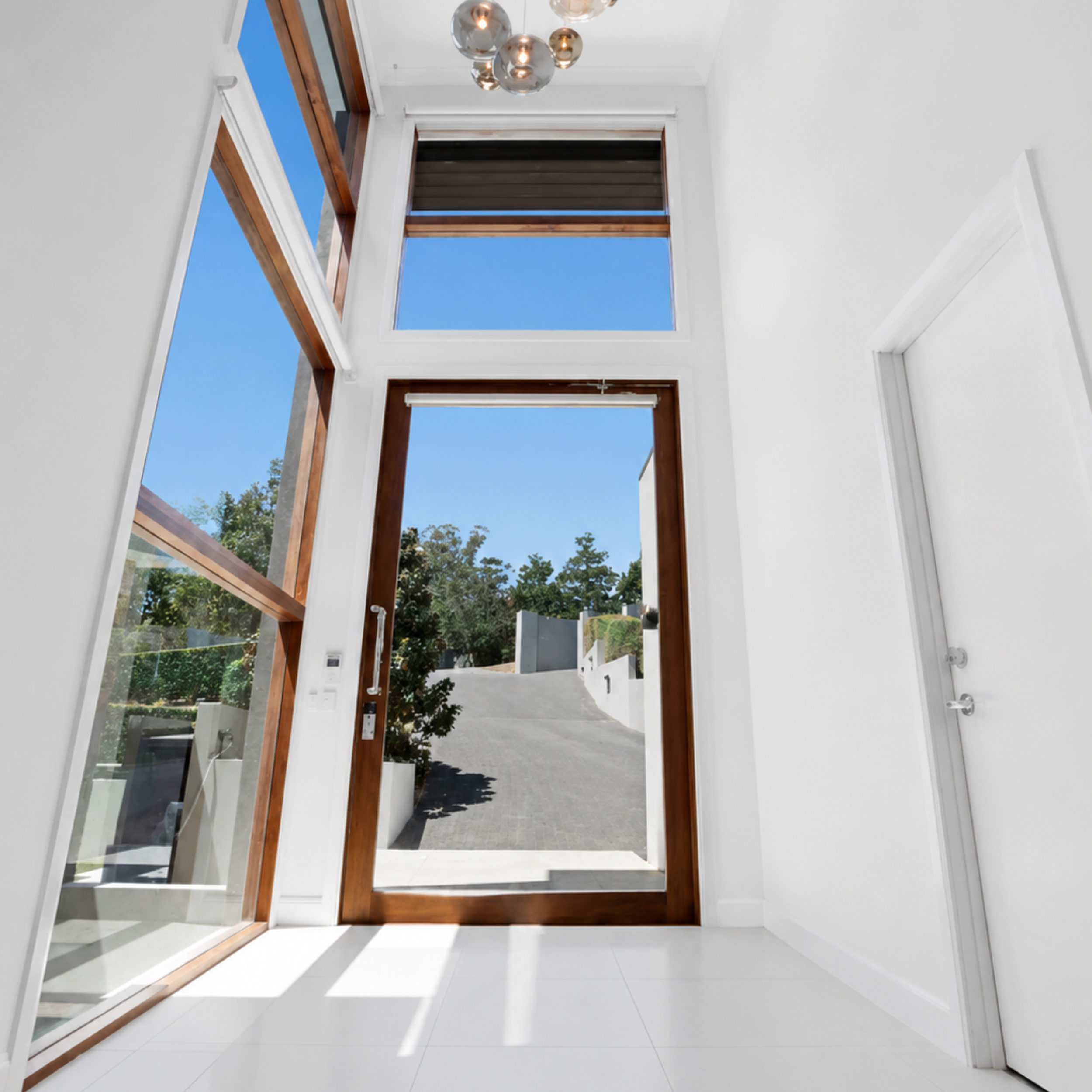 Finished residential interior painting with white walls and hallway