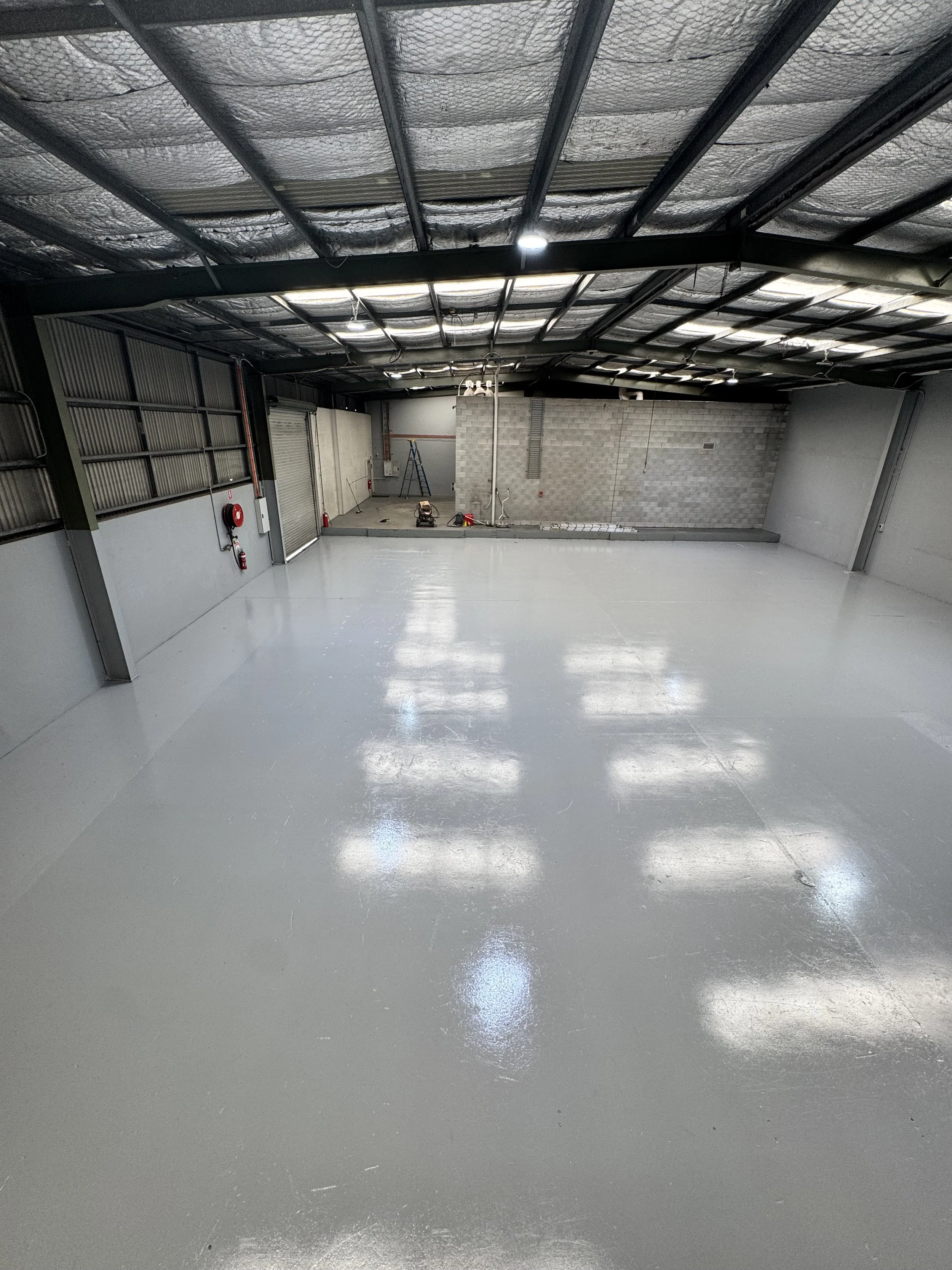 Completed warehouse floor painting project by CAC Coatings in Bethania
