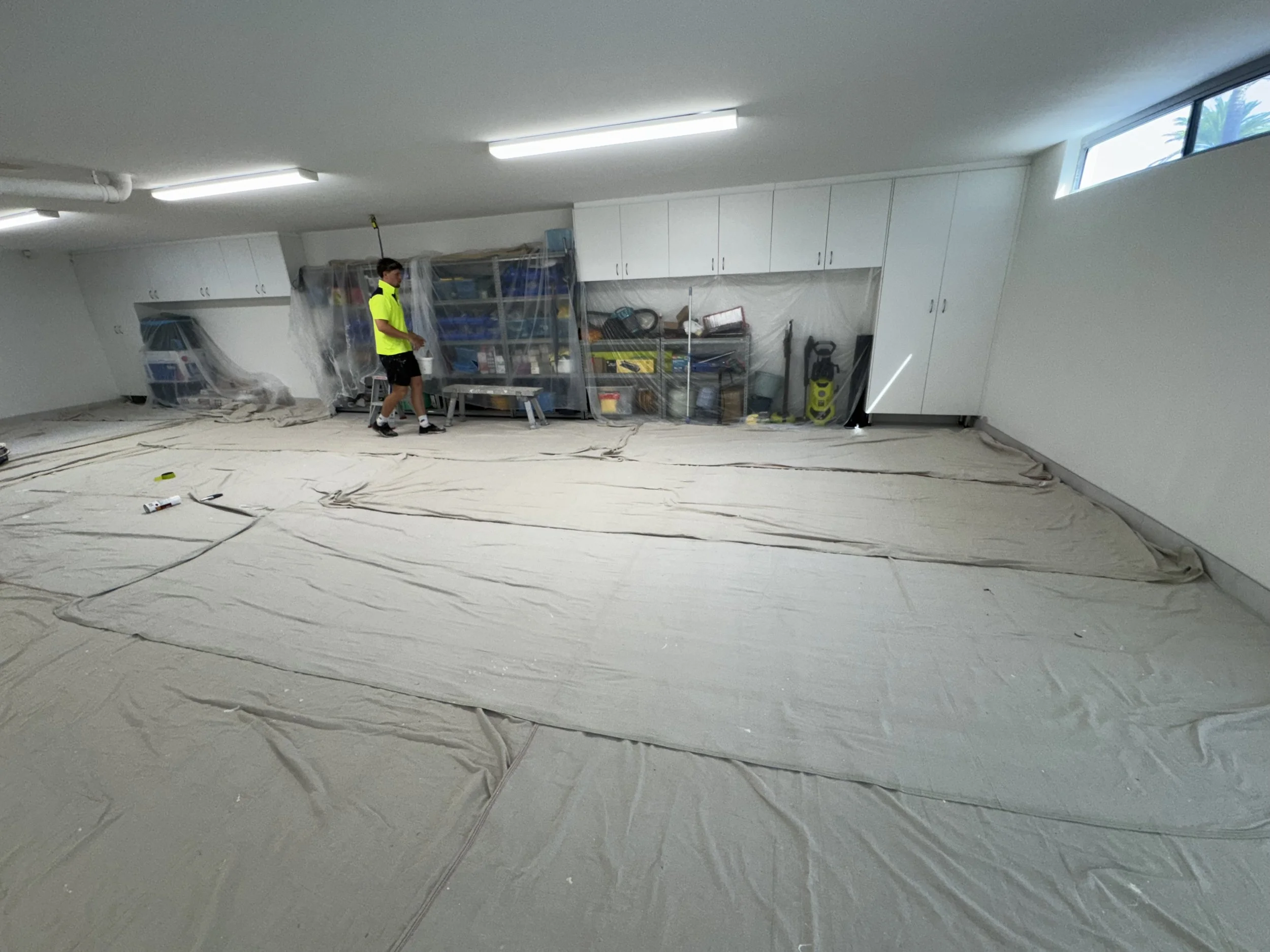 Interior painting preparation with floors and kitchen protected