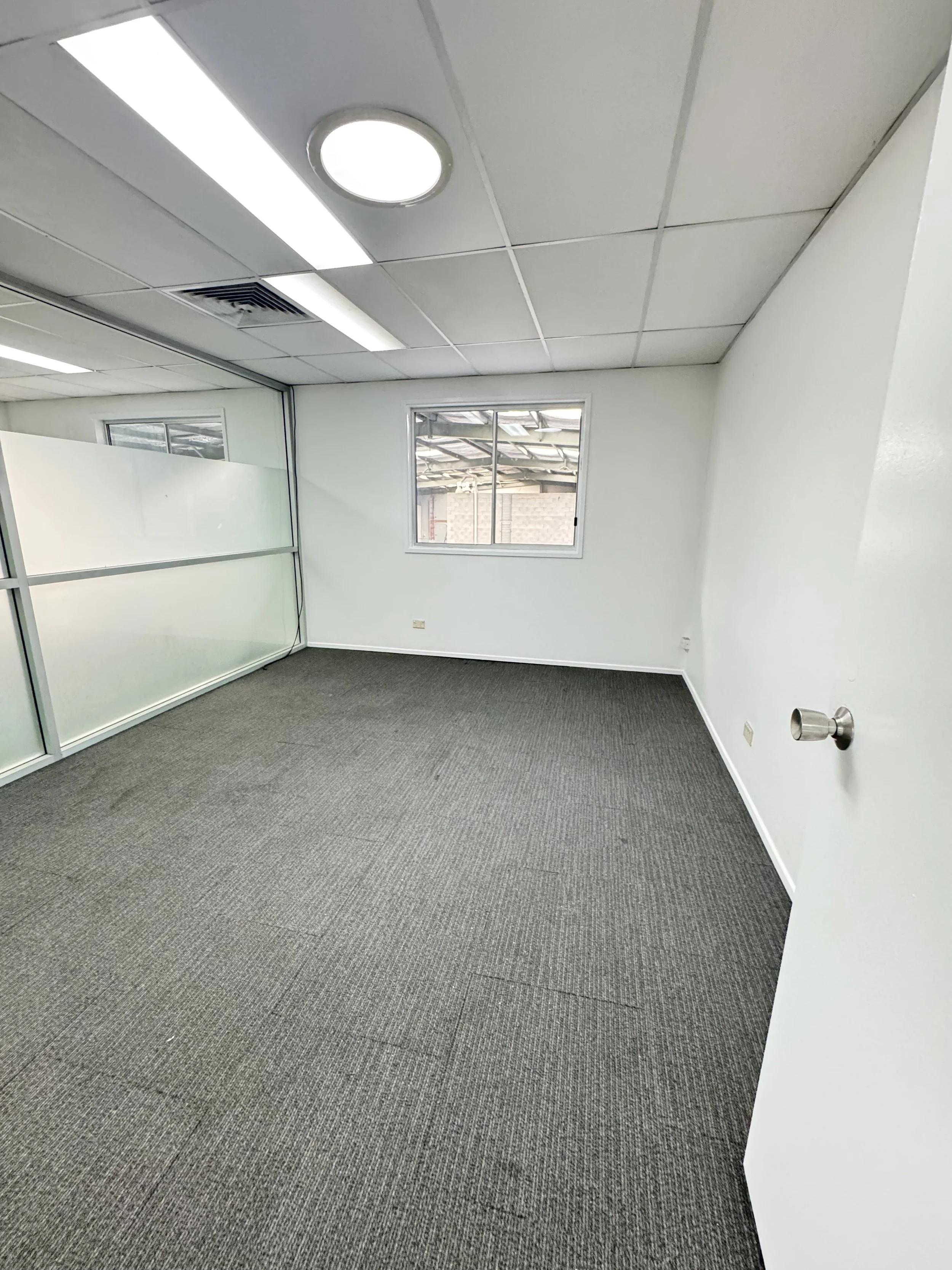 Freshly painted commercial office with white walls and ceiling