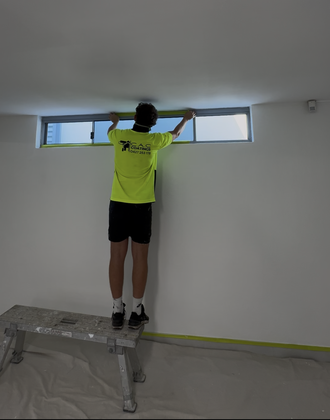 Interior wall painting in progress by CAC Coatings