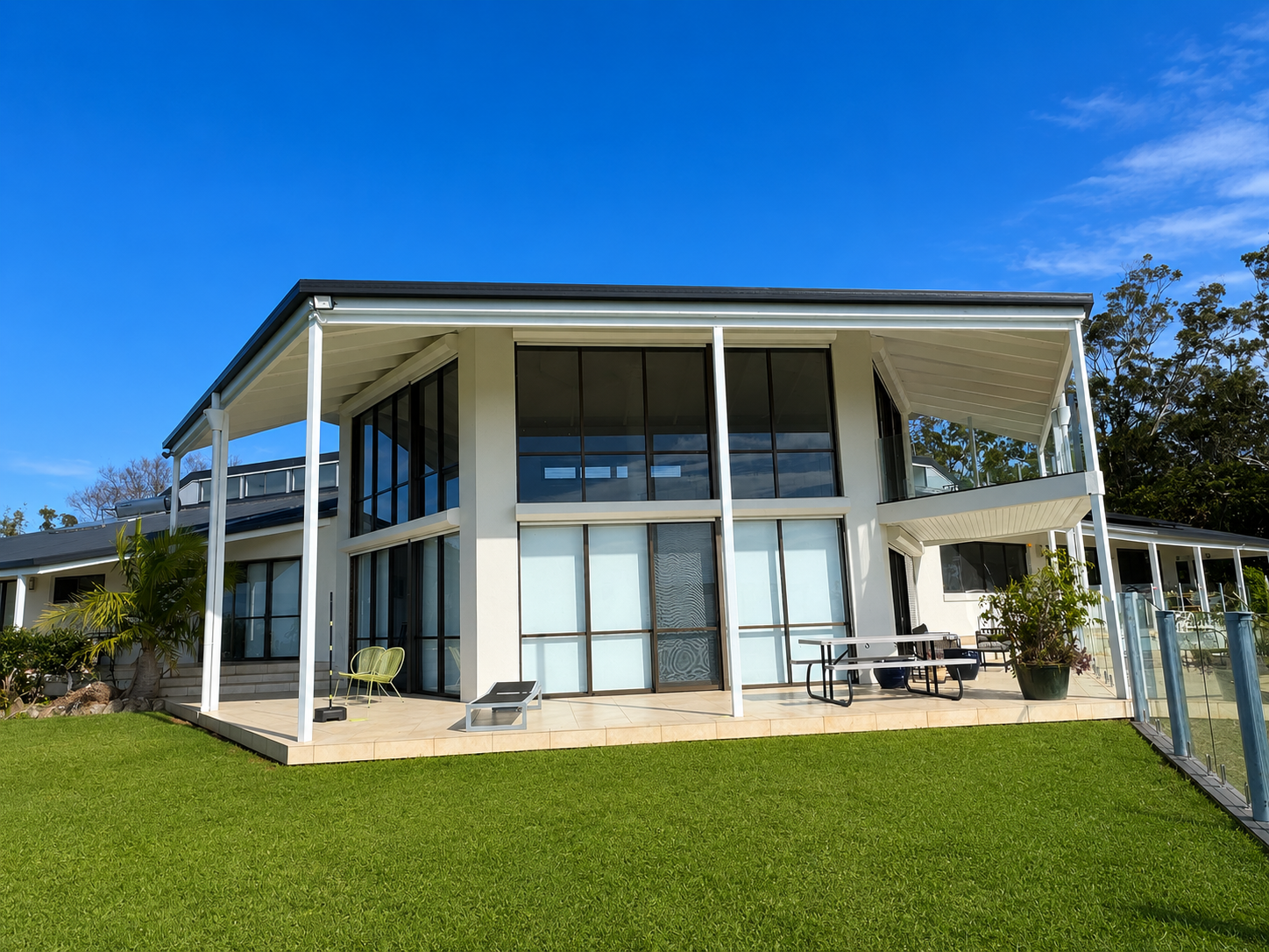 Completed exterior repaint of a modern two-storey home by CAC Coatings.