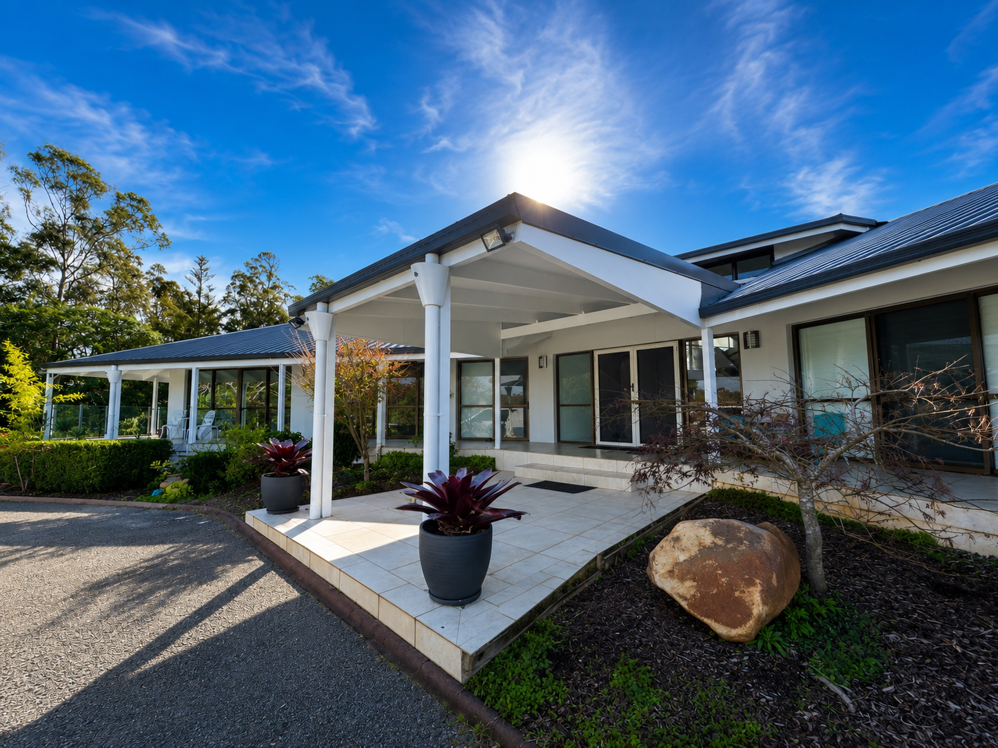 Freshly painted exterior of a modern residential home by CAC Coatings.