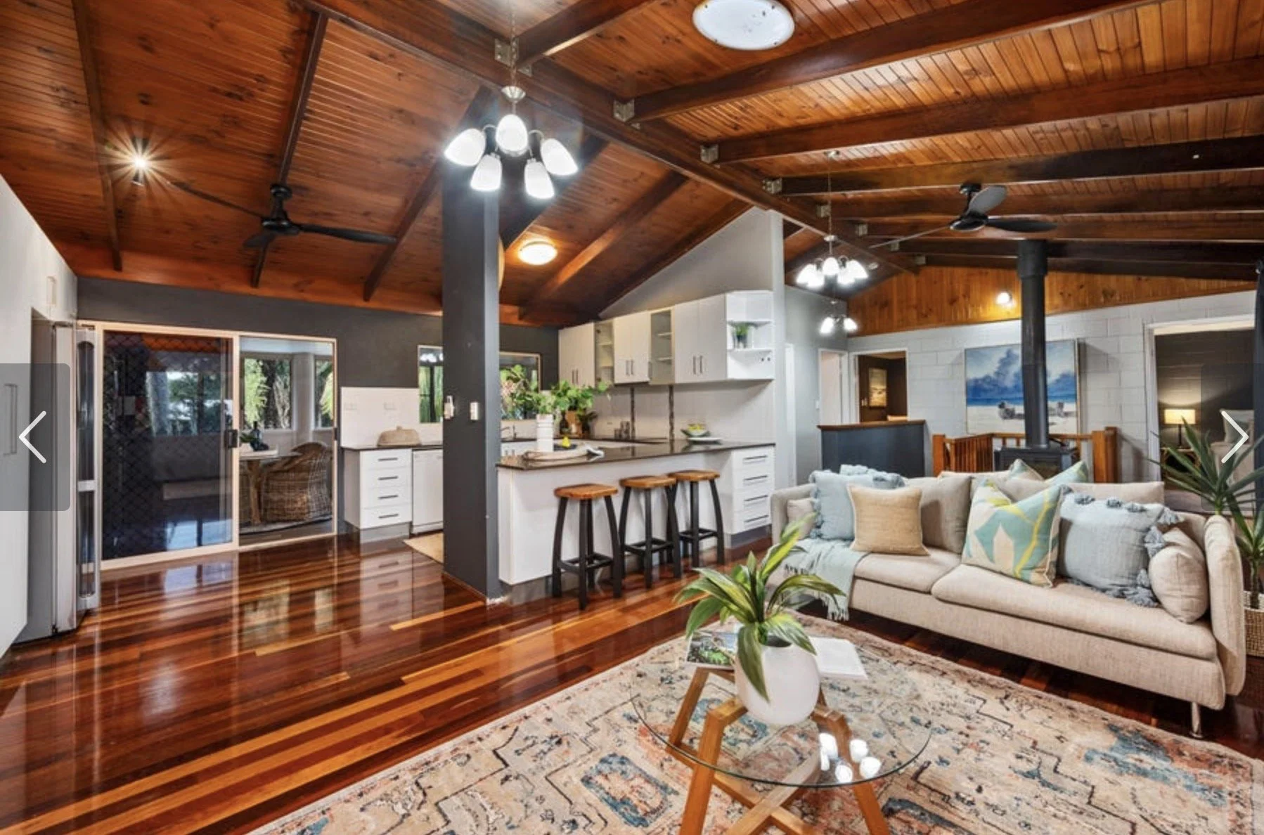 Residential interior renovation in Townsville with stained timber ceiling, rendered walls and painted finishes