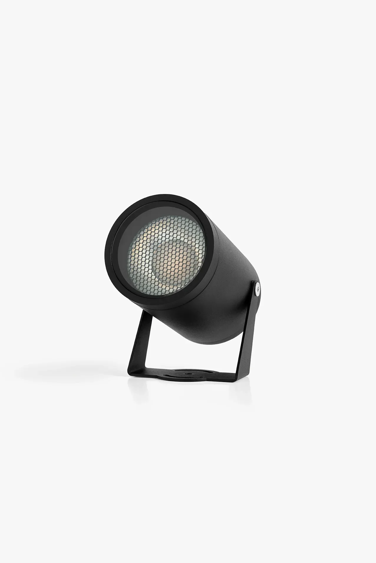 A black outdoor spotlight by LIK Lighting, with a honeycomb grille on a white background.