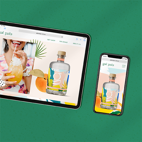 Digital devices displaying a website for gal pals with images of a woman drinking a cocktail, a bottle of gin, and fruit, set against a green textured background.