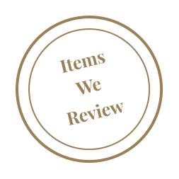 Circular emblem with two concentric circles containing the text 'Items We Review' in the center