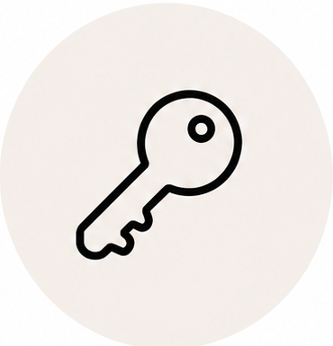 Black outline of a key on a light gray background.