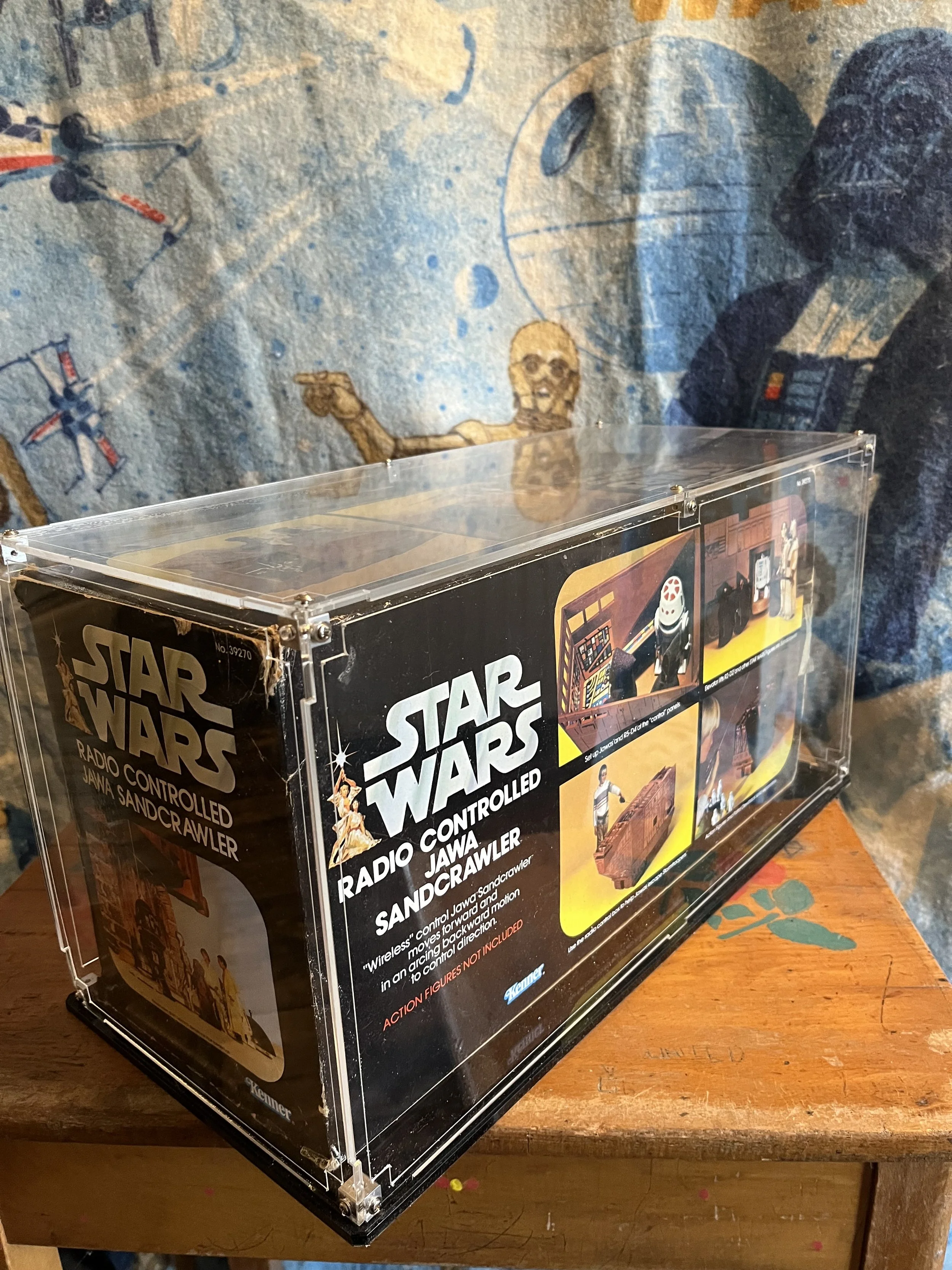 A vintage Kenner Star Wars radio-controlled Jawa Sandcrawler toy in original box
